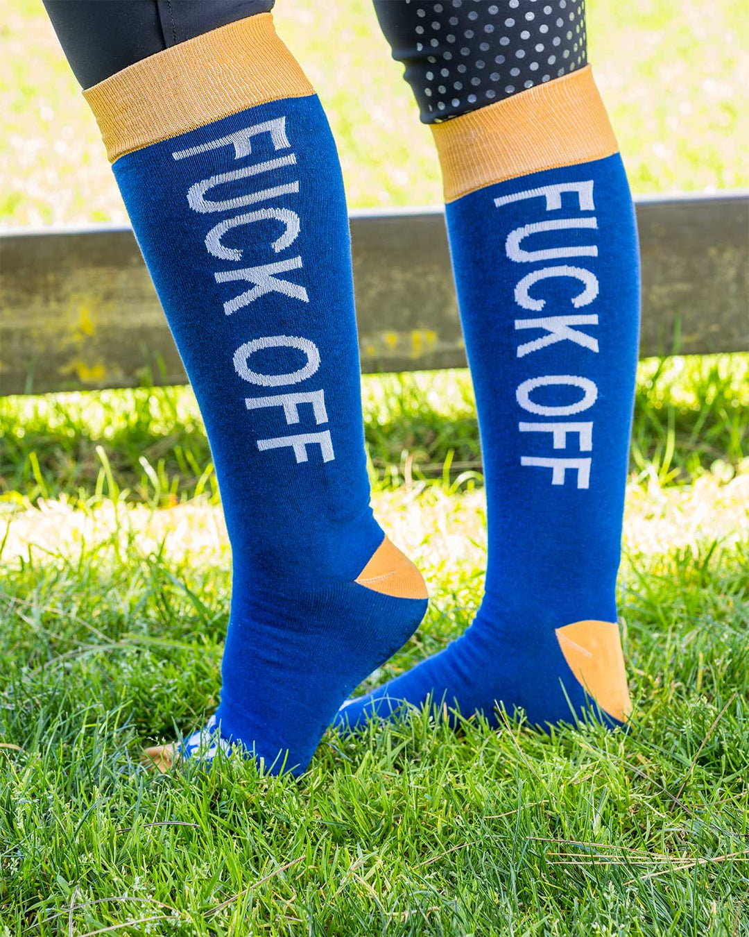 Blue Socks featuring Karl Cook’s bold FUCK OFF design, perfect for riding boots and equestrian style.